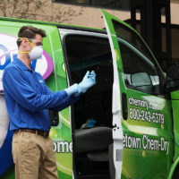 Chem-Dry carpet cleaning franchise owner puts on gloves